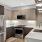 c-shaped kitchen with open counter lit by overhead pendant fixtures