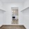 large walk-in closet with ample lighting and built-in shelving