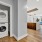 full sized washer and dryer in closet next to kitchen